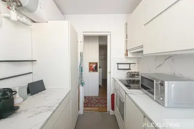 Cuisine ou kitchenette dans l'établissement Unique T2 proche de l'arc de triomphe