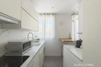 Cuisine ou kitchenette dans l'établissement Unique T2 proche de l'arc de triomphe