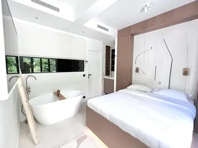 Un ou plusieurs lits dans un hébergement de l'établissement Duplex elegant au coeur du Marais avec cinema - 6P