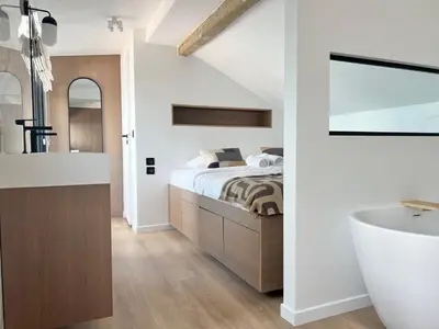 Un ou plusieurs lits dans un hébergement de l'établissement Duplex elegant au coeur du Marais avec cinema - 6P
