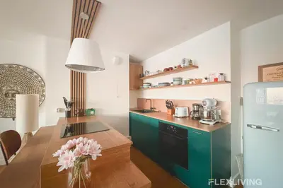 Cuisine ou kitchenette dans l'établissement Spacieux T3 dans le 13ème avec petit balcon et vu sur les toits de Paris