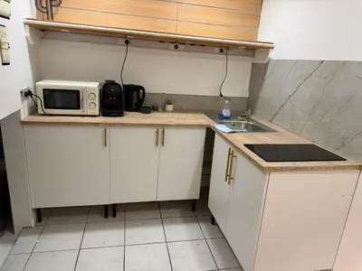 Cuisine ou kitchenette dans l'établissement La Maison Cachée moderne