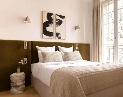 Un ou plusieurs lits dans un hébergement de l'établissement Harmony Collection I 2BR Suite 4P Opera Grevin