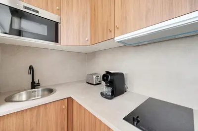 Cuisine ou kitchenette dans l'établissement Suite de Charme - L023