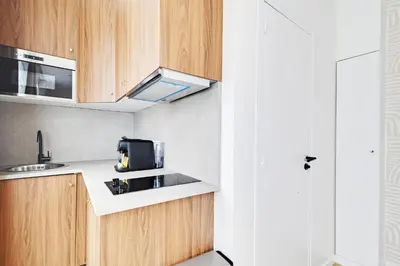 Cuisine ou kitchenette dans l'établissement Suite de Charme - L023
