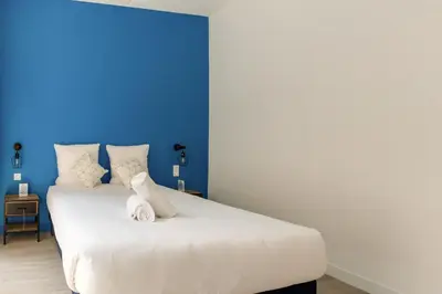Un ou plusieurs lits dans un hébergement de l'établissement Lafayette - Appartement Gare du Nord 8P