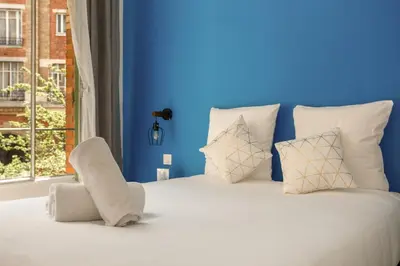 Un ou plusieurs lits dans un hébergement de l'établissement Lafayette - Appartement Gare du Nord 8P