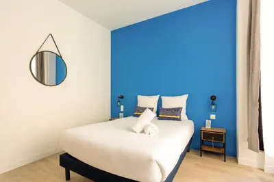 Un ou plusieurs lits dans un hébergement de l'établissement Lafayette - Appartement Gare du Nord 8P