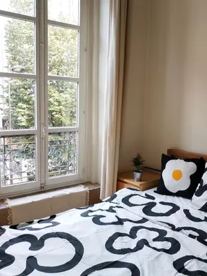 Un ou plusieurs lits dans un hébergement de l'établissement Central Artistic Appartement - Paris 2e