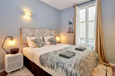 Un ou plusieurs lits dans un hébergement de l'établissement Souplex - 1 chambre 1 salon