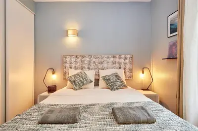 Un ou plusieurs lits dans un hébergement de l'établissement Souplex - 1 chambre 1 salon