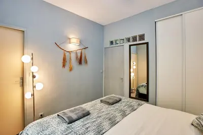 Un ou plusieurs lits dans un hébergement de l'établissement Souplex - 1 chambre 1 salon