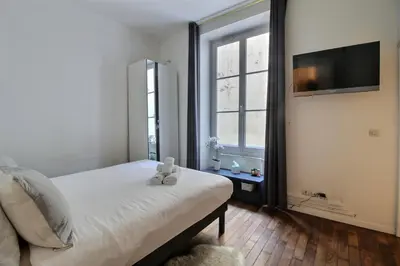 Un ou plusieurs lits dans un hébergement de l'établissement Paris Center - Louvre & Rivoli