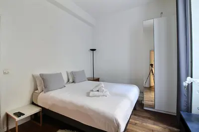 Un ou plusieurs lits dans un hébergement de l'établissement Paris Center - Louvre & Rivoli