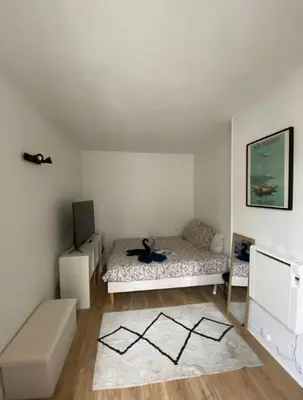 Un ou plusieurs lits dans un hébergement de l'établissement Elevate your home Clichy
