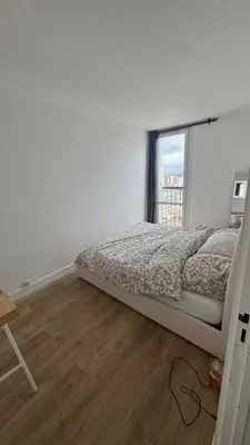 Un ou plusieurs lits dans un hébergement de l'établissement Grand appartement Parking et Metro