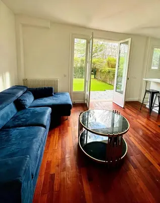 Coin salon dans l'établissement Exceptional apartment with private garden