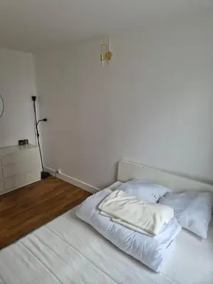 Un ou plusieurs lits dans un hébergement de l'établissement 4-room apartment La Défense