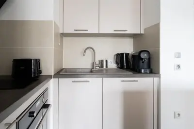 Cuisine ou kitchenette dans l'établissement Appartement Marceau - Welkeys