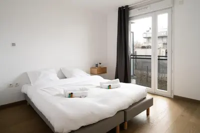 Un ou plusieurs lits dans un hébergement de l'établissement Appartement Marceau - Welkeys