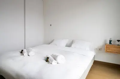 Un ou plusieurs lits dans un hébergement de l'établissement Appartement Marceau - Welkeys
