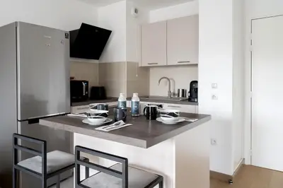 Cuisine ou kitchenette dans l'établissement Appartement Marceau - Welkeys