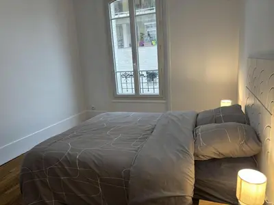 Un ou plusieurs lits dans un hébergement de l'établissement Le Haussmann Charme parisien - Spacieux