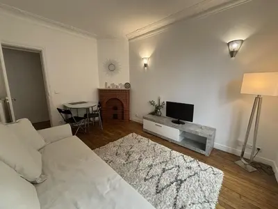 Un ou plusieurs lits dans un hébergement de l'établissement Le Haussmann Charme parisien - Spacieux