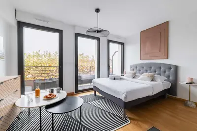 Un ou plusieurs lits dans un hébergement de l'établissement Studio lumineux avec terrasse Courbevoie - 2P