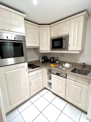 Cuisine ou kitchenette dans l'établissement L'appartement Pierre Charron L