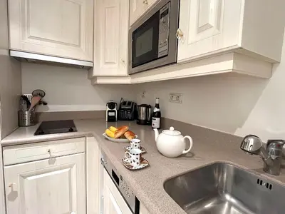 Cuisine ou kitchenette dans l'établissement L'appartement Pierre Charron L
