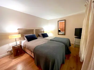 Un ou plusieurs lits dans un hébergement de l'établissement L'appartement Pierre Charron L
