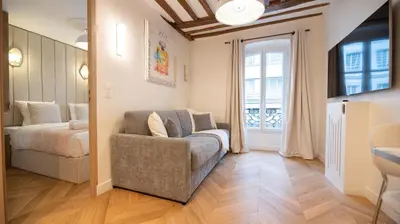 Un ou plusieurs lits dans un hébergement de l'établissement Cosy Apartment in Paris - Champs Elysées