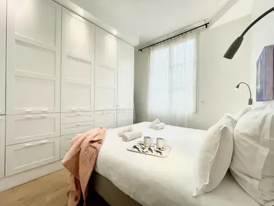 Un ou plusieurs lits dans un hébergement de l'établissement Parisian Home 2 bedrooms Montorgueil 090