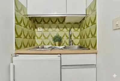 Cuisine ou kitchenette dans l'établissement Cozy Comfortable Studio in the Heart of Paris 12th