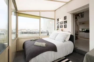 Un ou plusieurs lits dans un hébergement de l'établissement Loft Duplex Terrasse View on Paris