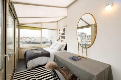 Un ou plusieurs lits dans un hébergement de l'établissement Loft Duplex Terrasse View on Paris
