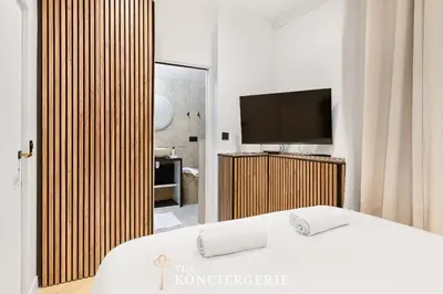 Un ou plusieurs lits dans un hébergement de l'établissement Appartement de prestige avec balcon - Paris 16e
