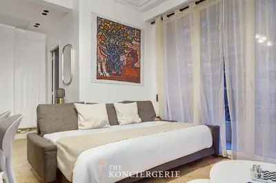 Un ou plusieurs lits dans un hébergement de l'établissement Appartement de prestige avec balcon - Paris 16e