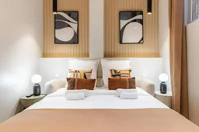 Un ou plusieurs lits dans un hébergement de l'établissement Elegant 3-room air-conditioned apartment in the heart of Paris 10