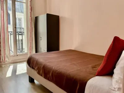 Un ou plusieurs lits dans un hébergement de l'établissement Apartment Haussmann Opera by Interhome