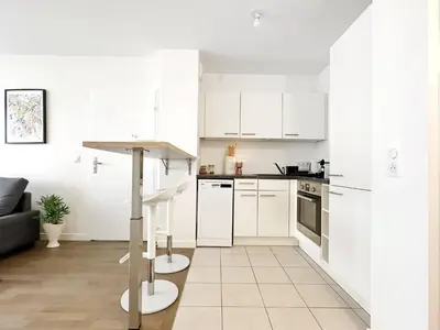 Cuisine ou kitchenette dans l'établissement LEnsoleill Levallois Apartment near metro