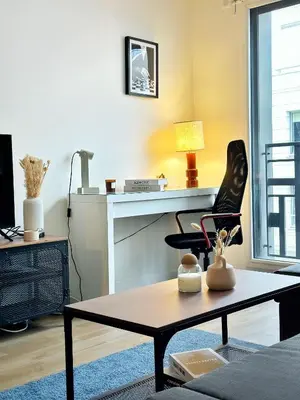 Coin salon dans l'établissement LEnsoleill Levallois Apartment near metro