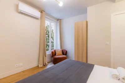 Un ou plusieurs lits dans un hébergement de l'établissement Exceptional triplex with 6 bedrooms & air conditioning