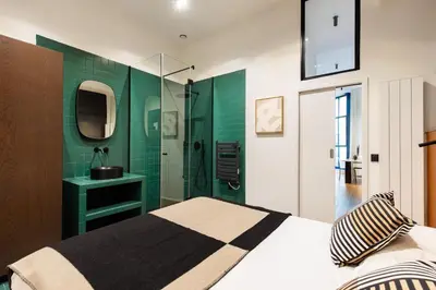 Un ou plusieurs lits dans un hébergement de l'établissement NoChichi Collections - Loft atypique Sentier
