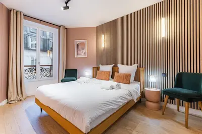 Un ou plusieurs lits dans un hébergement de l'établissement Beautiful Apartment in the Heart of Paris