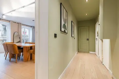 Télévision ou salle de divertissement dans l'établissement Beautiful Apartment in the Heart of Paris