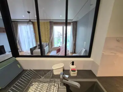 Coin salon dans l'établissement Appartement cozy à Courbevoie