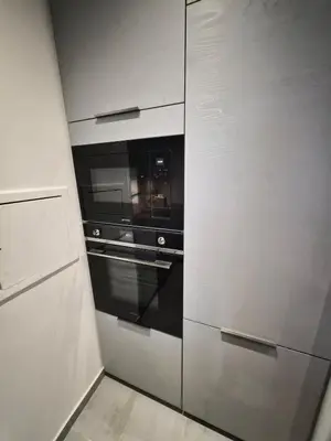 Cuisine ou kitchenette dans l'établissement Appartement cozy à Courbevoie