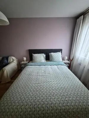 Un ou plusieurs lits dans un hébergement de l'établissement Appartement cozy à Courbevoie